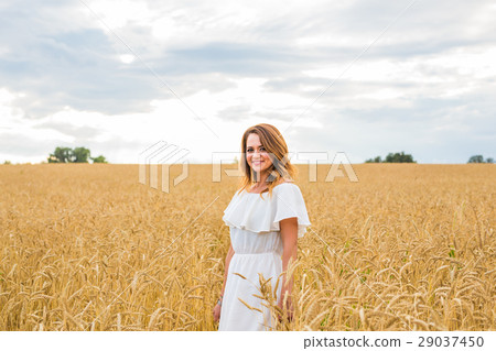 Beauty Girl Outdoors enjoying nature on the Field 29037450