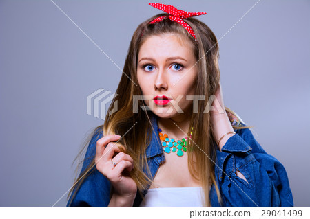 Surprised young woman in jeans jacket Surprised young woman in jeans jacket 29041499