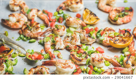Close-up of grilled tiger prawns over grey Close-up of grilled tiger prawns over grey 29041667