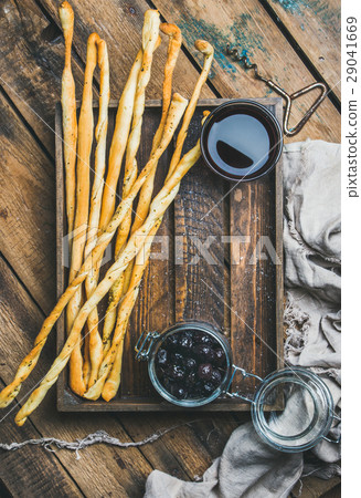 Grissini bread sticks, black olives, red wine in Grissini bread sticks, black olives, red wine in 29041669