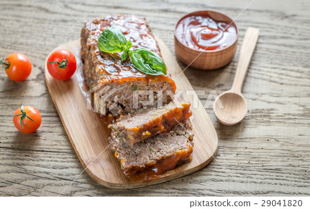 Meat loaf with barbecue sauce on the wooden board 29041820