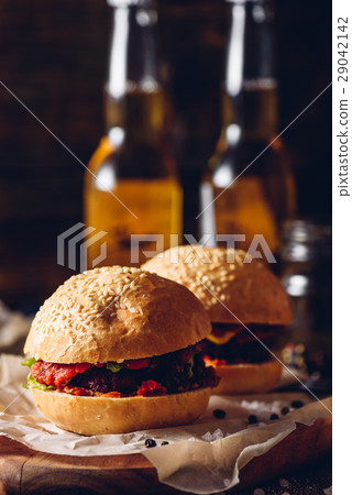 Two Cheeseburger on Cutting Board. 29042142