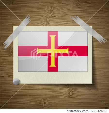 Flags Guernsey at frame on wooden texture. Vector Flags Guernsey at frame on wooden texture. Vector 29042692