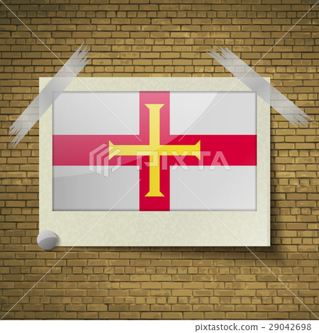 Flags Guernsey at frame on a brick background. Vec 29042698