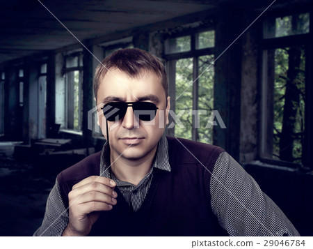 Young male with funny sunglasses on a stick Young male with funny sunglasses on a stick 29046784