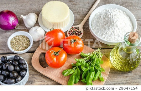 Ingredients for pizza on the wooden background Ingredients for pizza on the wooden background 29047154