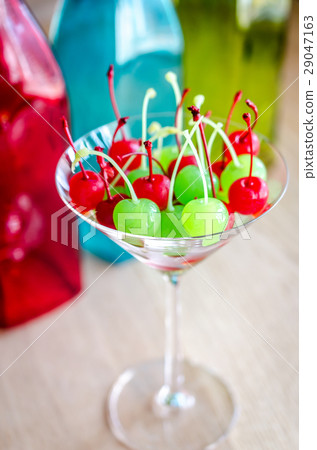 Glace cherries in martini glass 29047163