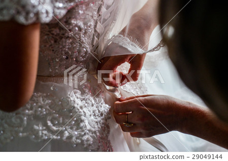 Garter on the leg of a bride, Wedding day moments Garter on the leg of a bride, Wedding day moments 29049144
