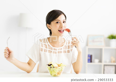 beautiful young woman eating healthy food beautiful young woman eating healthy food 29053333