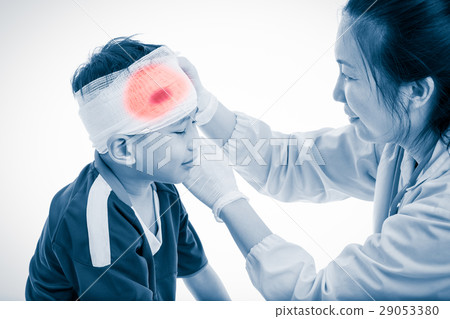 Sport injury. Doctor makes bandage on head patient Sport injury. Doctor makes bandage on head patient 29053380