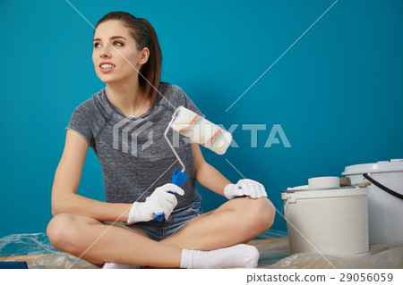 bright picture of lovely housewife painting at home 29056059