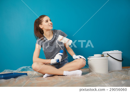 bright picture of lovely housewife painting at home 29056060