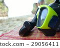 Green Snorkel and Diving mask on Mat at the sea. 29056411
