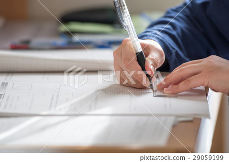 Junior high school students studying for exam 29059199