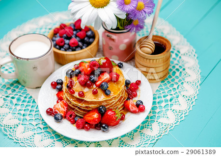 Stack of pancakes on wooden background Stack of pancakes on wooden background 29061389
