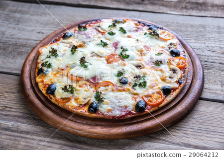 Cooked pizza on the wooden board 29064212