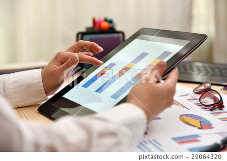 trader woman touching tablet with graph trader woman touching tablet with graph 29064320