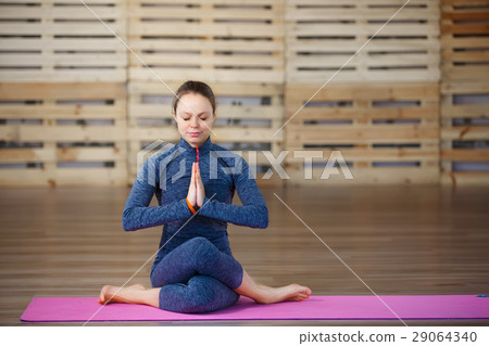 Young attractive woman practicing yoga, exercise 29064340