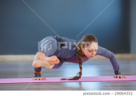 Young attractive woman practicing yoga, standing 29064352
