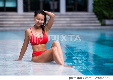 Portrait of beautiful, young lady in red bikini Portrait of beautiful, young lady in red bikini 29064859