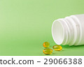 Fish oil pills and a bottle of medicine 29066388