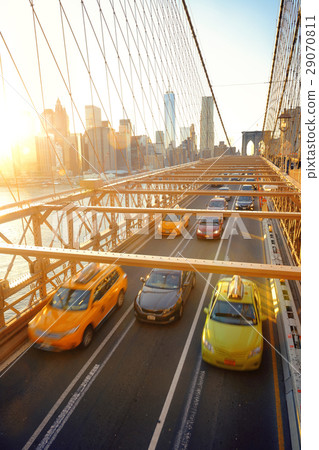 Brooklyn Bridge with traffic at sunset 29070811