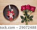 romantic setting with a wood dish and red roses 29072488