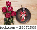 romantic setting with a wood dish and red roses 29072509