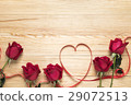 Red roses and a heart on wooden board 29072513