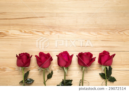 Red Roses on Wooden Background 29072514