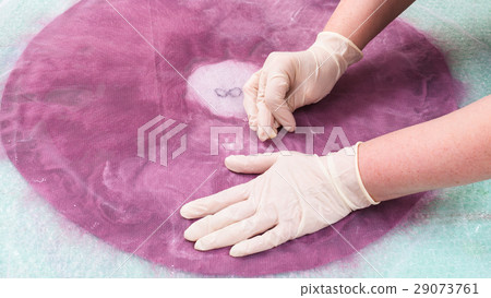 milliner soaps the fibers on back side of layout 29073761