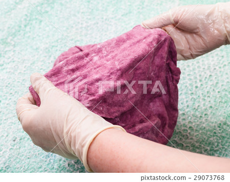 hatter felts the wet felt hood from wool fibers 29073768