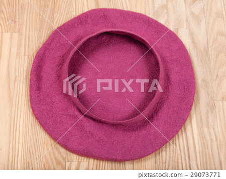 handmade felt beret is forming on wooden table 29073771