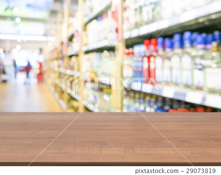 Brown wooden empty table in front of blurred Brown wooden empty table in front of blurred 29073819
