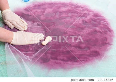 hatter soaps the wool fibers on layout through net 29073856