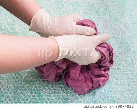 hatter tangles the wet felt hood from wool fibers 29074028