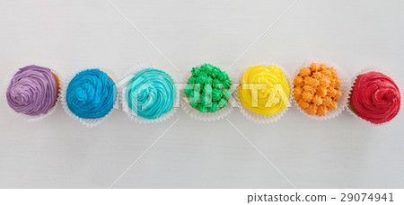 Rainbow cupcakes on white background Rainbow cupcakes on white background 29074941