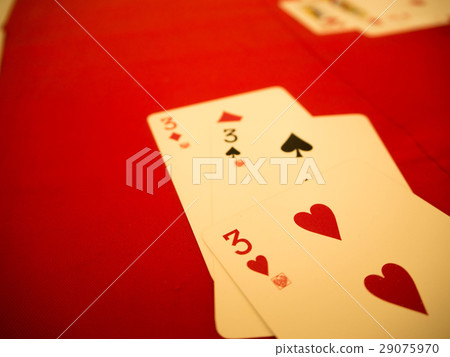 Playing cards on red table Playing cards on red table 29075970