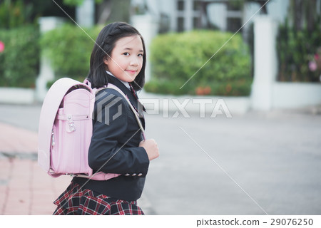 Asian school girl with pink backpack outdoors 29076250