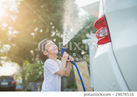 Asian children washing car 29076518