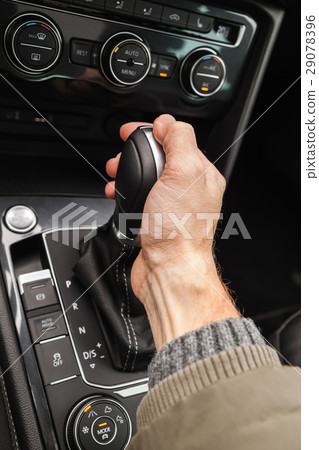 Driver hand holds gear lever Driver hand holds gear lever 29078396