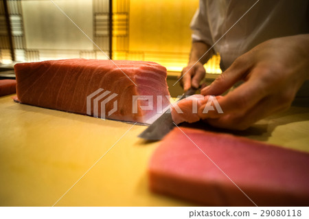 Sushi craftsman dealing fish 29080118