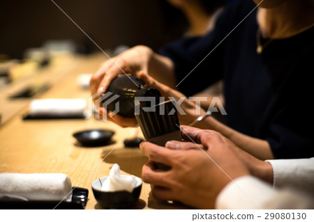 Families enjoying sushi 29080130