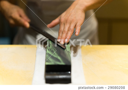 Craftsmen sharpening knives 29080208