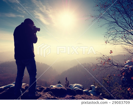 Tall man is taking photo by mirror camera on neck Tall man is taking photo by mirror camera on neck 29083709