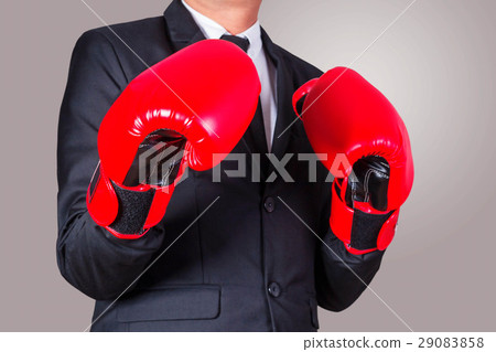 business man puts on boxing gloves. business man puts on boxing gloves. 29083858