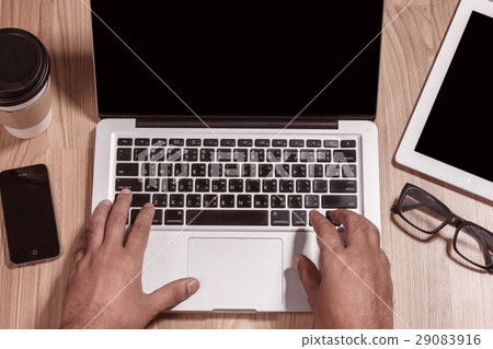 Hands typing on a notebook. Hands typing on a notebook. 29083916