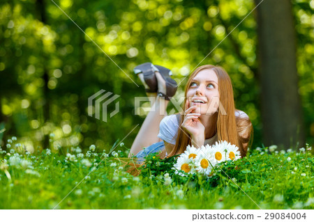 Beautiful smiling red-haired young woman 29084004