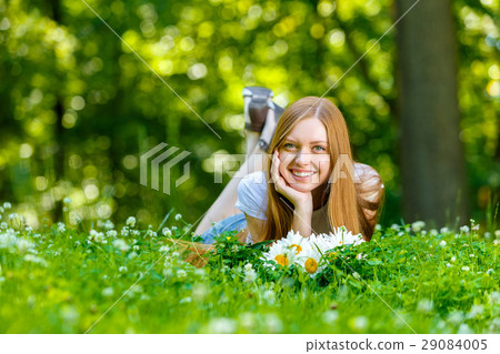 Beautiful smiling red-haired young woman 29084005