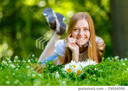 Beautiful smiling red-haired young woman Beautiful smiling red-haired young woman 29084006